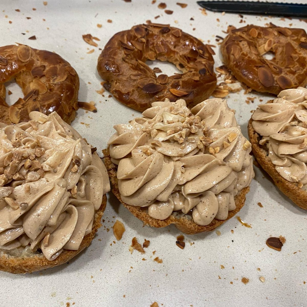 Paris-Brest being filled with praline cream